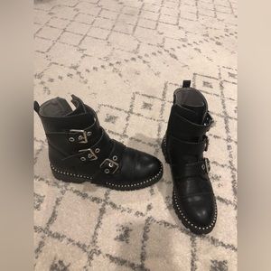 Black and silver combat boots.